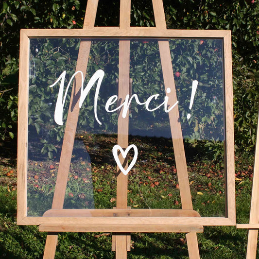 panneau en plexi avec lettrage Merci blanc et cadre en bois